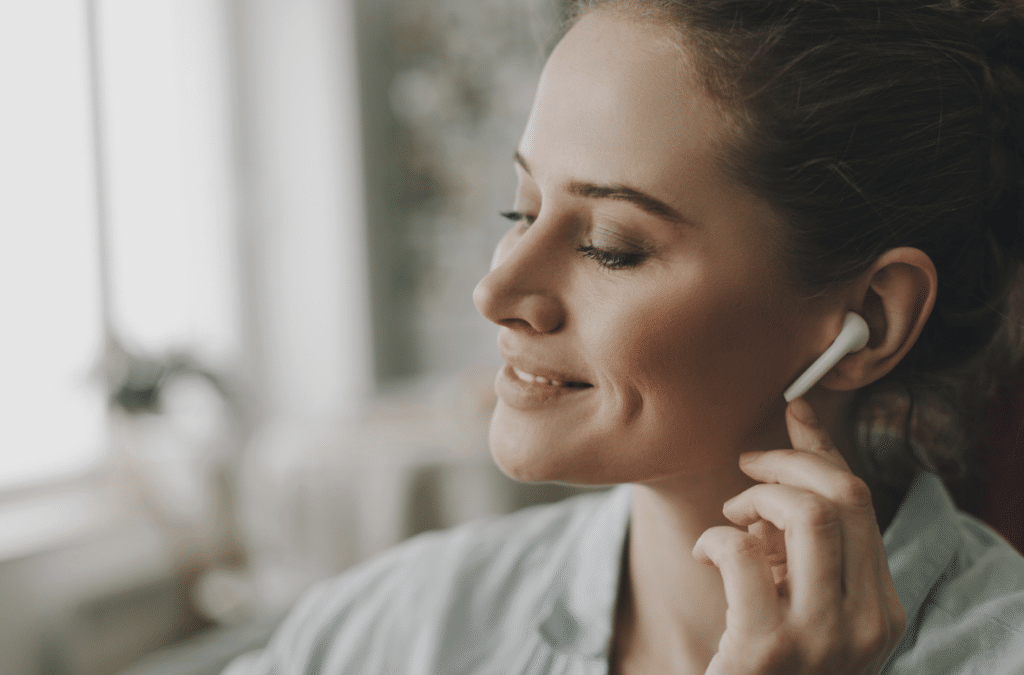 lady listening to the NuvoDesk Playlist at work